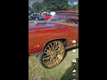 Tangerine colored donk on savini wheels short