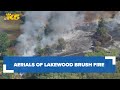 Brush fire threatens homes in Lakewood