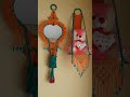 orange green micrane mirror and doll hanging