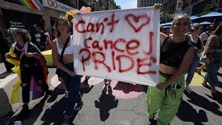 Montrealers march downtown after the Pride parade's last-minute cancelation