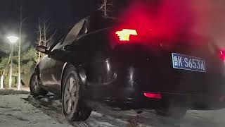 girl driving car in snow but stuck revving009