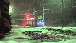 Trains in the evening snow (Croatia)  (4K)