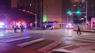 Electrical pole suspended in air by power lines after bottom half taken out by driver