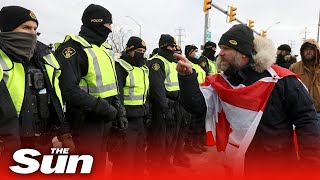 Freedom Convoy: Police start to clear protesters blocking US-Canada border