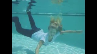 @TrinaMason Playboy Miss Social model Trina Mason fully clothed underwater swimming pool happy