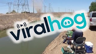 Dust Devil Blows into Fisherman || ViralHog