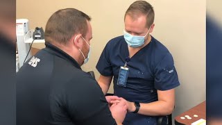 Nurse surprised by proposal during vaccination