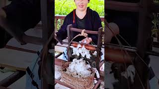 The traditional process of separating cotton seeds.