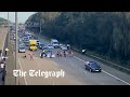 Insulate Britain protesters run in front of cars to block M25 again