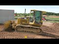 caterpillar d5g dozer grading around foundation