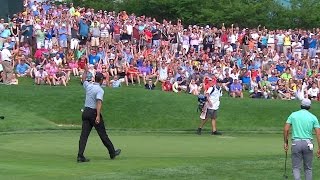 Tiger Woods motors in his 29-foot putt for birdie at the Memorial