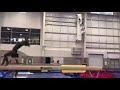 simone biles training double layout off the beam