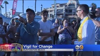 Emotional Vigil Held At Huntington Beach Pier For People Killed By Police