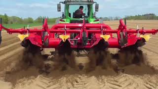 Great cultivator mounted behind tractor for easy tilling.