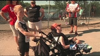 Eight year old helps disabled brother compete in triathlon - Karen Lehr