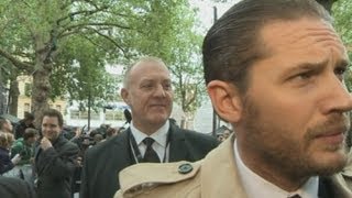 Tom Hardy kicks off with reporter at The Dark Knight Rises premiere, London