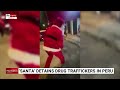 undercover santa filmed carrying out drug busts in peru