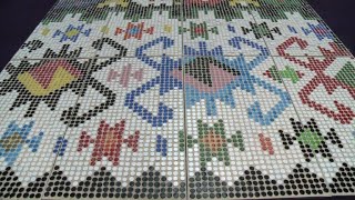 Rug made of 25 thousand plastic bottle caps on display