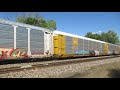 cn 5797 5689 move an eastbound automobile carrier freight train through vicksburg mi