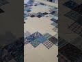 digital quilting design fluent on a blue and white quilt