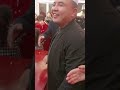 an imam chanting at a chinese muslim wedding