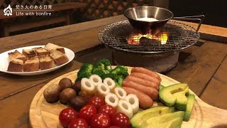 Cheese fondue on a charcoal stove\