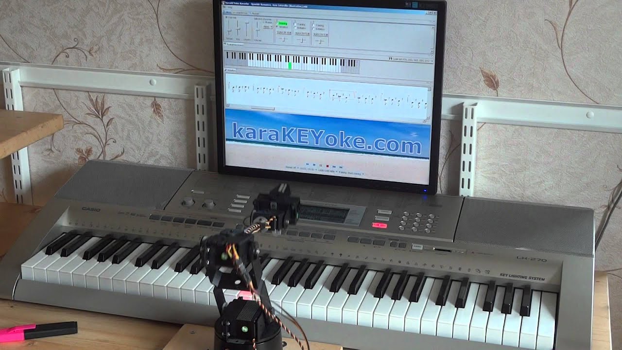 Robot Plays Piano Using KaraKEYoke Teaching Software - YouTube