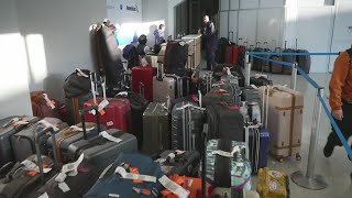 Airport delays and cancellations remain up as airlines recover from winter storm