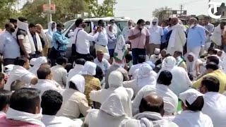 Farmers, arhtiyas block Karnal-Indri state highway over slow lifting of wheat at Indri grain market