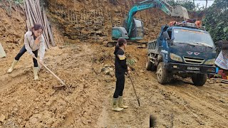 girl agricultural machine driver, hired to excavate and repair roads for trucks carrying dirt