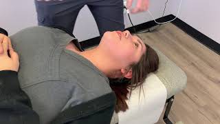 FACE ADJUSTMENT. Chiropractor adjusts the sutures of the face and the ears.