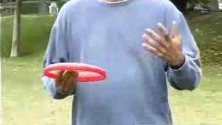 How to Throw a Frisbee and How to Play Disc Golf \u0026 Frisbee Football : How to Throw a Frisbee Using a Behind the Back Throw