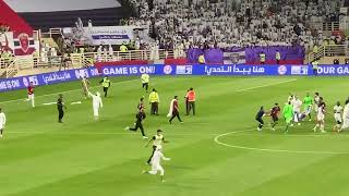 Wahda fans invade pitch and fight police after Al Ain game, Soufiane Rahimi provokes by taking flag