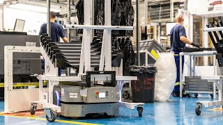 Operators and robots work in harmony: Grupo Antolin automates handling of car interior components