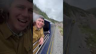 A train with a covered deck in Alaska