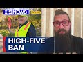 Beloved lollipop man banned from high-fiving student after single complaint | 9 News Australia