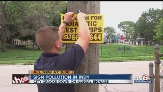 City cracking down on illegal signs