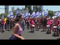 Protesters block roads in Tel Aviv and Jerusalem as they mark nine months since start of Gaza war