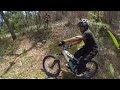 rider with downhill bike in action at merinding hill labuan