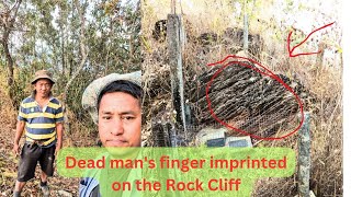 Visiting the dead man's finger imprinted on the rock cliff