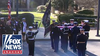 Former President Jimmy Carter’s motorcade arrives at Carter Center