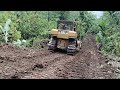 highly experienced caterpillar d6r xl bulldozer operator working on widening plantation roads