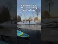 paddling between big ice block in the river. winter sup paddle boarding. nsp surfboards starboard