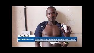 Owa Takisi akubiddwa amasasi mu lubuto.