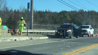 Lacey Township Police assisting construction workers working on pot hole