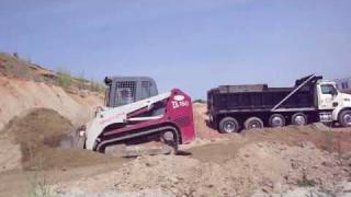 Loading a quad with the Takeuchi TL 150 Skid Steer