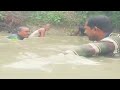 traditional cast net fishing on rainy session in village canal