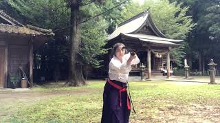 Samurai woman plays with Japanese sword.