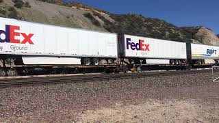 BNSF 7257 Leads Eastbound Intermodal Train passes through Blue Cut CA