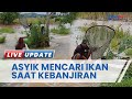 Warga di Panjaratan Kalimantan Selatan Malah Asyik Cari Ikan di Tengah Luapan Air Banjir